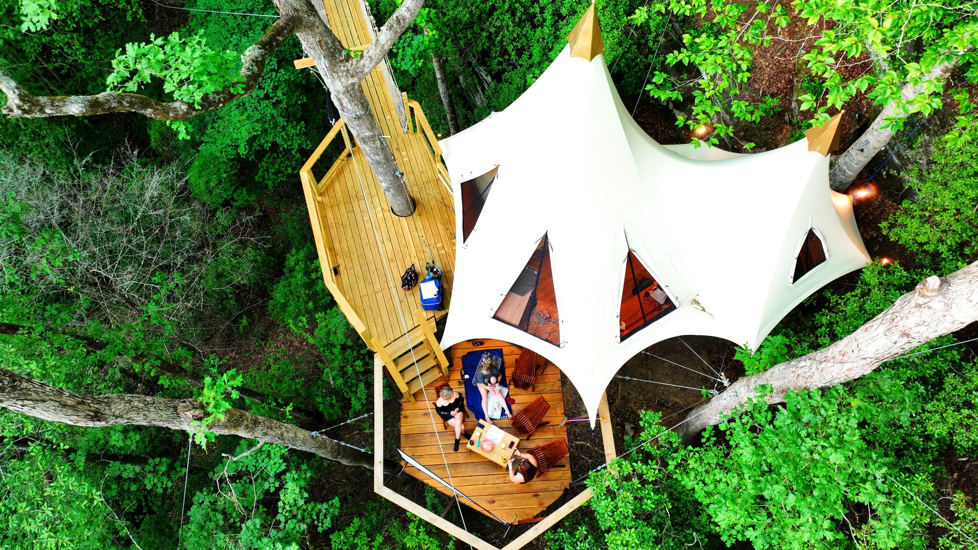From above, it disappears into the forest. By design.